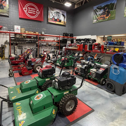 RentalsMachinery showroom with various lawn mowers and equipment on display.